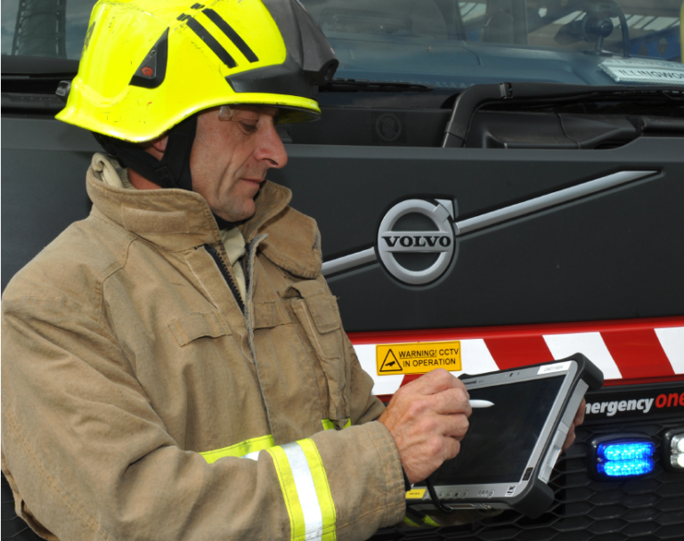 Firefighter using a electronic tablet. 
