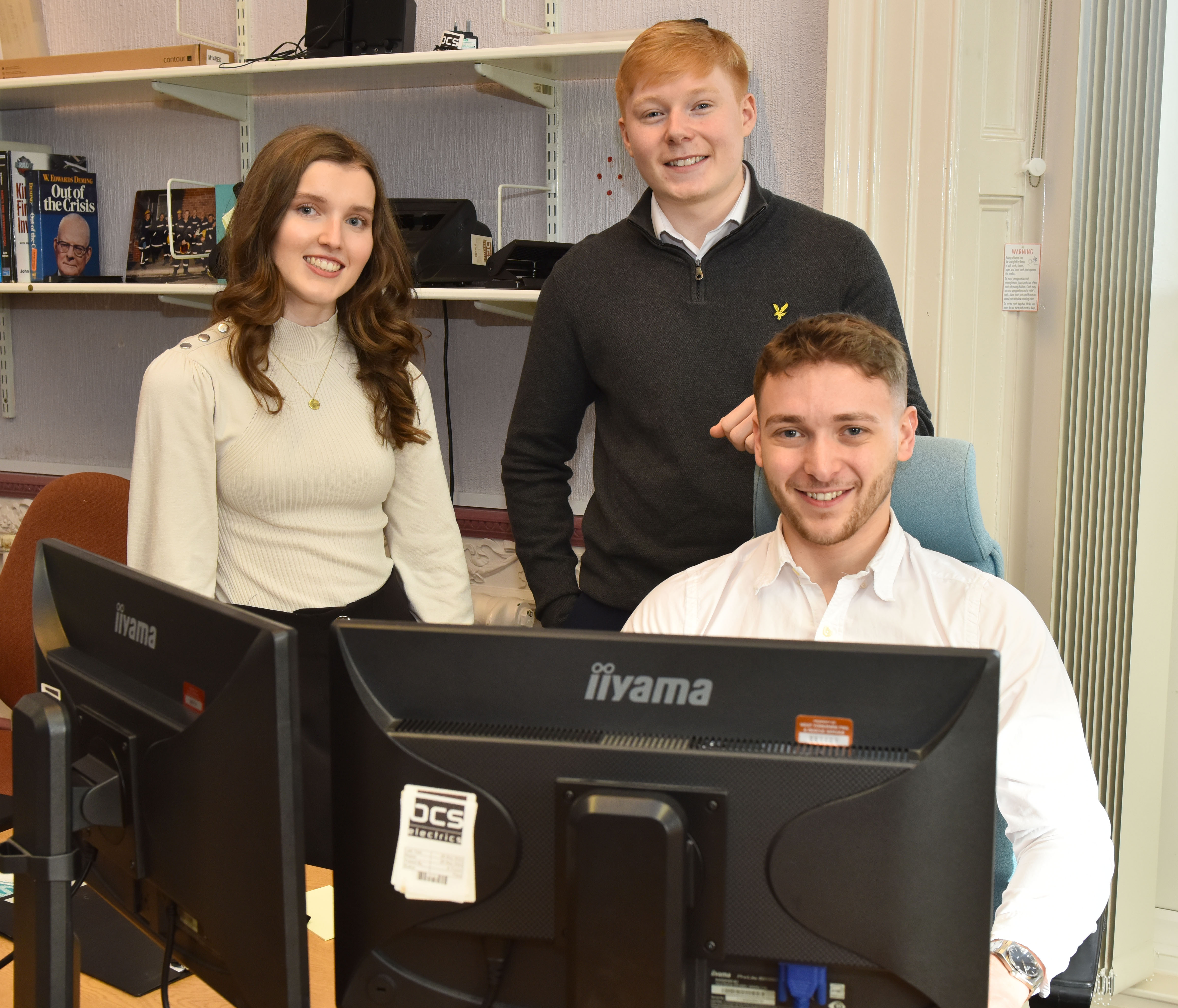 Lewis Bell, front, with apprentices Emily Chapman and Spencer Peck.