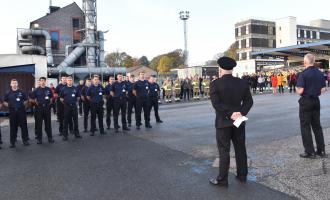 Photo of staff at HQ undertaking a minute's silence at Remembrance Day 2021.