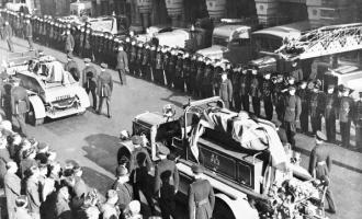 The funeral of fire officers Section leader Paul Cromwell & leading FF Walter Douthoit who were killed 11th Feb 1944 at Hembrigg Mills fire Morley - Scene outside Park Street Leeds central fire station