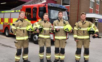 Firefighters at Rawdon Fire Station with the miniature engine