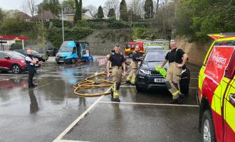 Firefighters at a charity car wash