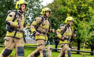Three firefighters running in Morley