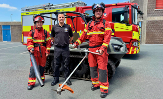 Firefighters in wildfire fire kit standing next to an ArgoCat with Wildfire equipment