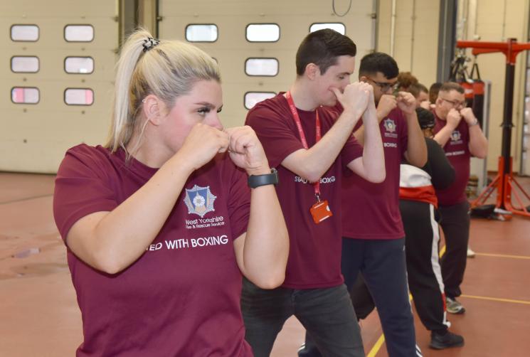 Rebecca Shooter, left, with young people on the boxing programme