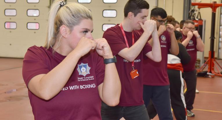 Rebecca Shooter, left, with young people on the boxing programme